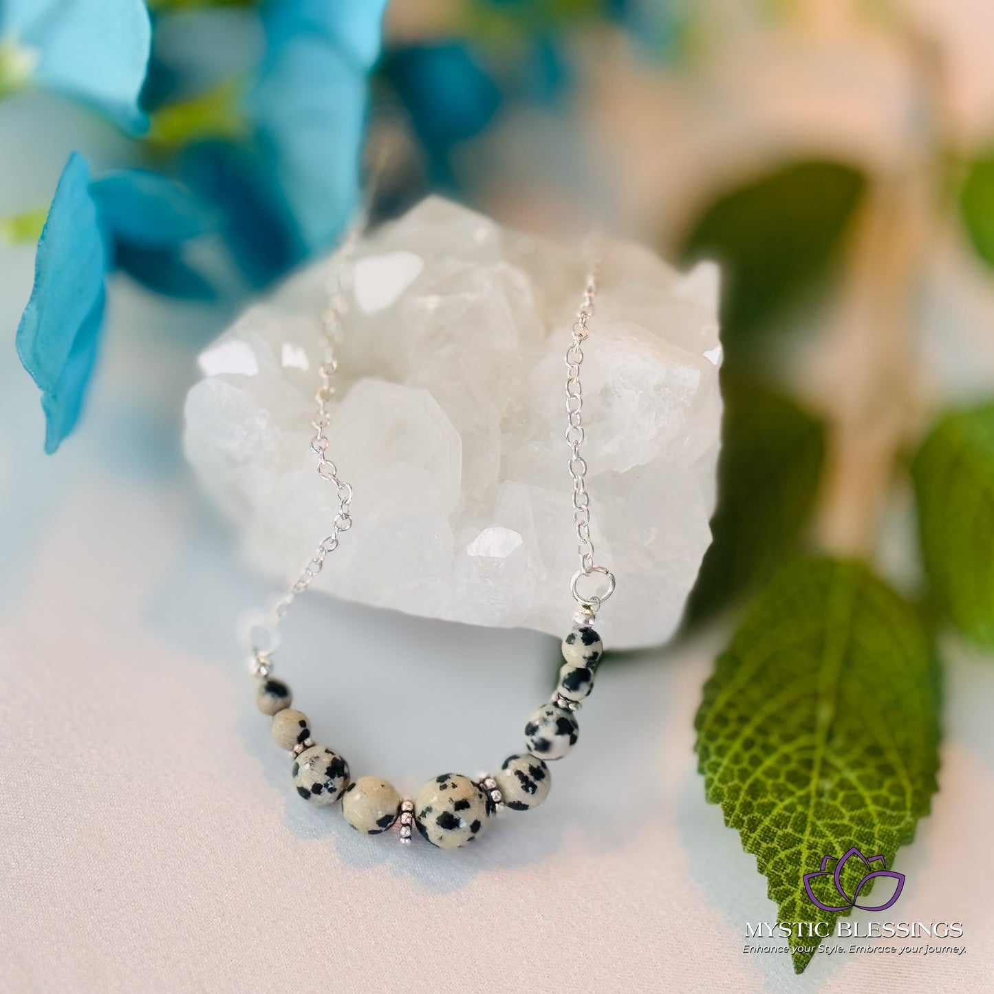 a close up of a necklace on a rock