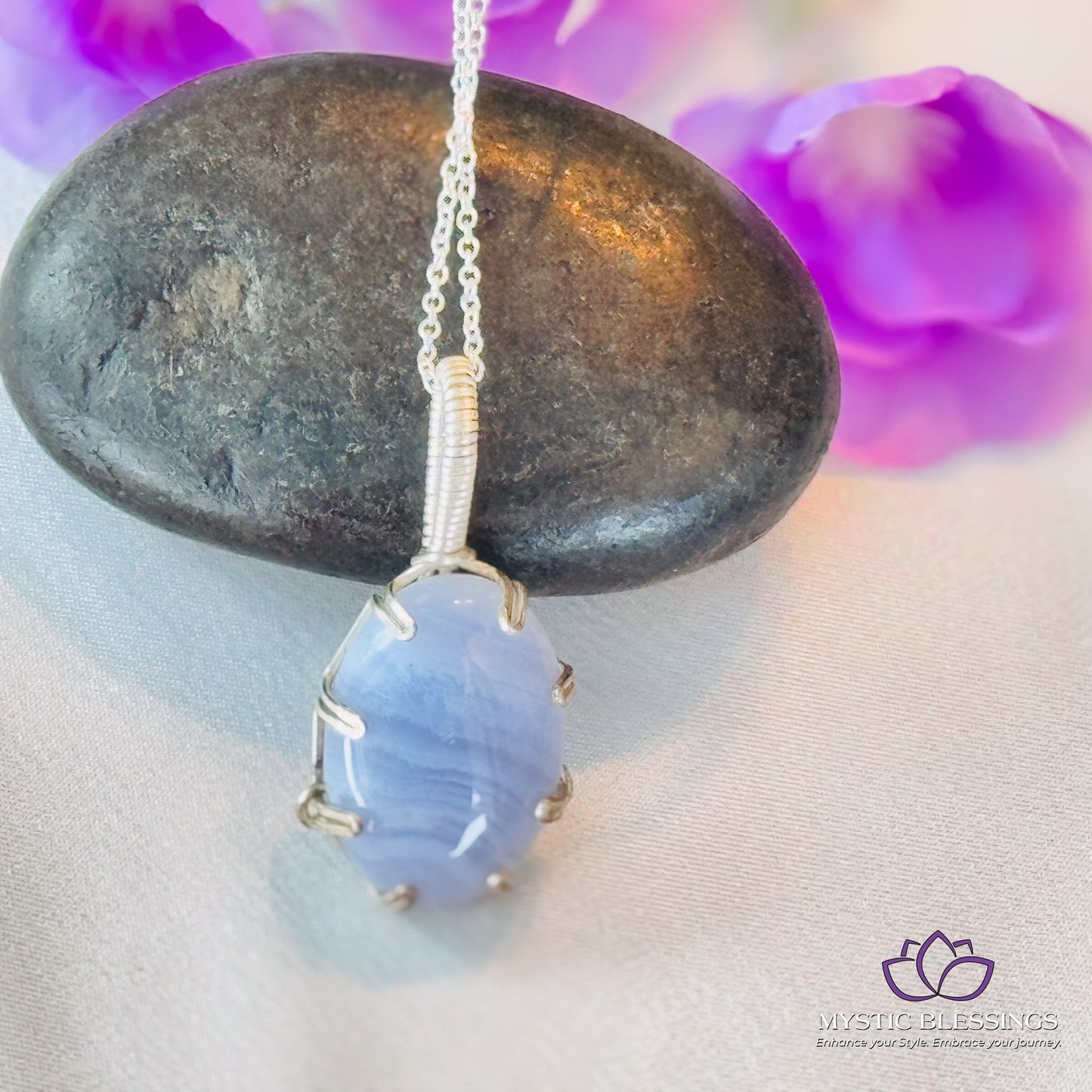 a blue stone sitting on top of a rock