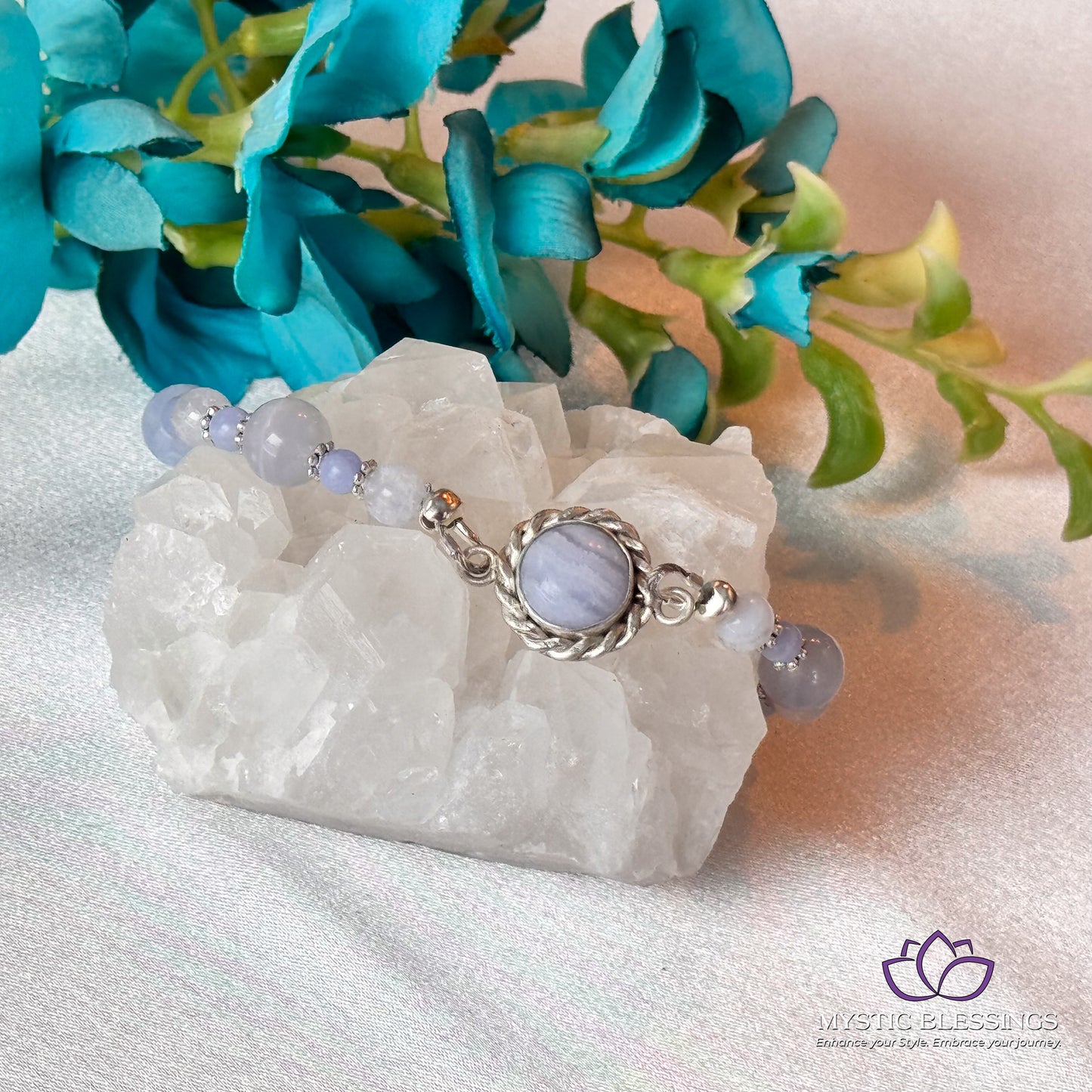 a close up of a piece of jewelry on a rock