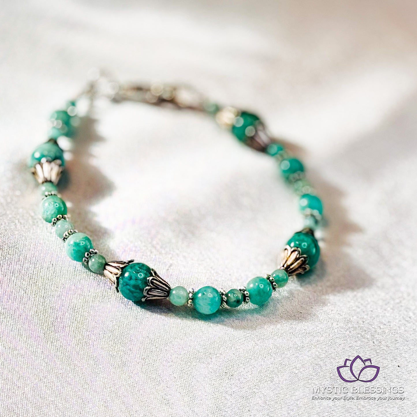 a close up of a bracelet on a white surface