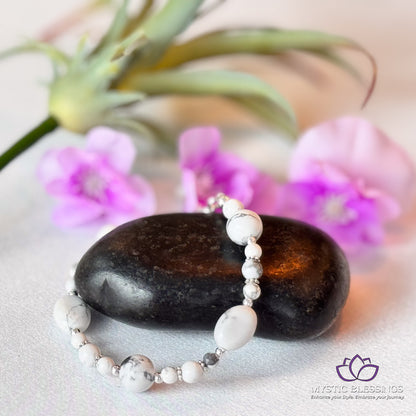 a close up of a rock and a flower