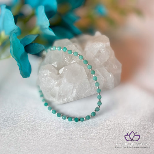 a close up of a bracelet on a rock