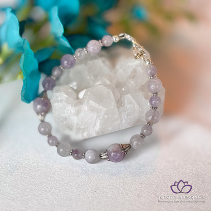 a close up of a bracelet on a table