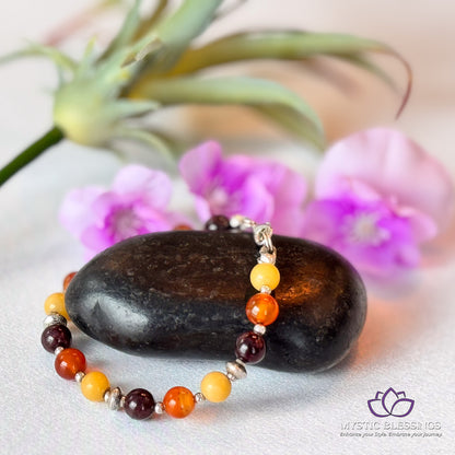 a close up of a rock and a flower